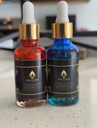 two bottles of cbd oil on a counter