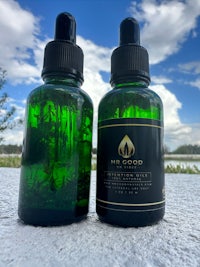 two bottles of cbd oil next to each other